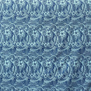A yard of polyester fabric with a traditional Polynesian tattoo design, featuring small hibiscus flowers and geometric patterns in a repeating motif on a purple background.