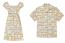 "Product flat lay of a matching beige and white Hibiscus Palaka set, featuring a women's square-neck puff-sleeve midi dress on the left and a men's short-sleeve button-down Aloha shirt on the right, both displaying a classic checkered pattern overlaid with white hibiscus floral motifs."