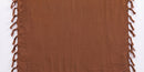 A vibrant brown solid-color sarong with fringed tassel edges on both short ends, laid flat against a white background.