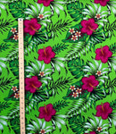 1st measurement of Couple wearing custom island apparel in Hibiscus Plumeria Tropical Leaves All Over Design Cotton Fabric with a tropical beach and ocean background.