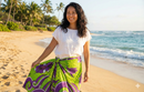 "Hibiscus Turtles Waves Polyester Sarong in Lime Green worn as a beach skirt cover-up. Polynesian print wrap with floral and sea life design."