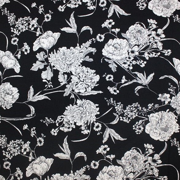 White Flowers on Black Printed Spandex | Blue Moon Fabrics