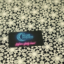 Ivory Flower Lace Pattern on Black Printed Spandex Fabric | Blue Moon Fabrics