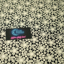 Ivory Flower Lace Pattern on Black Printed Spandex Fabric | Blue Moon Fabrics