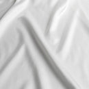 White 100% polyester bridal satin fabric by Islands Fabric for island wedding gowns, formal dresses, and ceremonial wear.