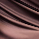 Solid bronze rayon challis fabric draped in soft, spiral folds. 
